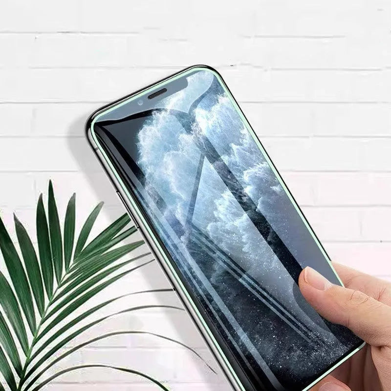 Luminous full cover tempered glass screen protector glowing for iPhone on a dark background.