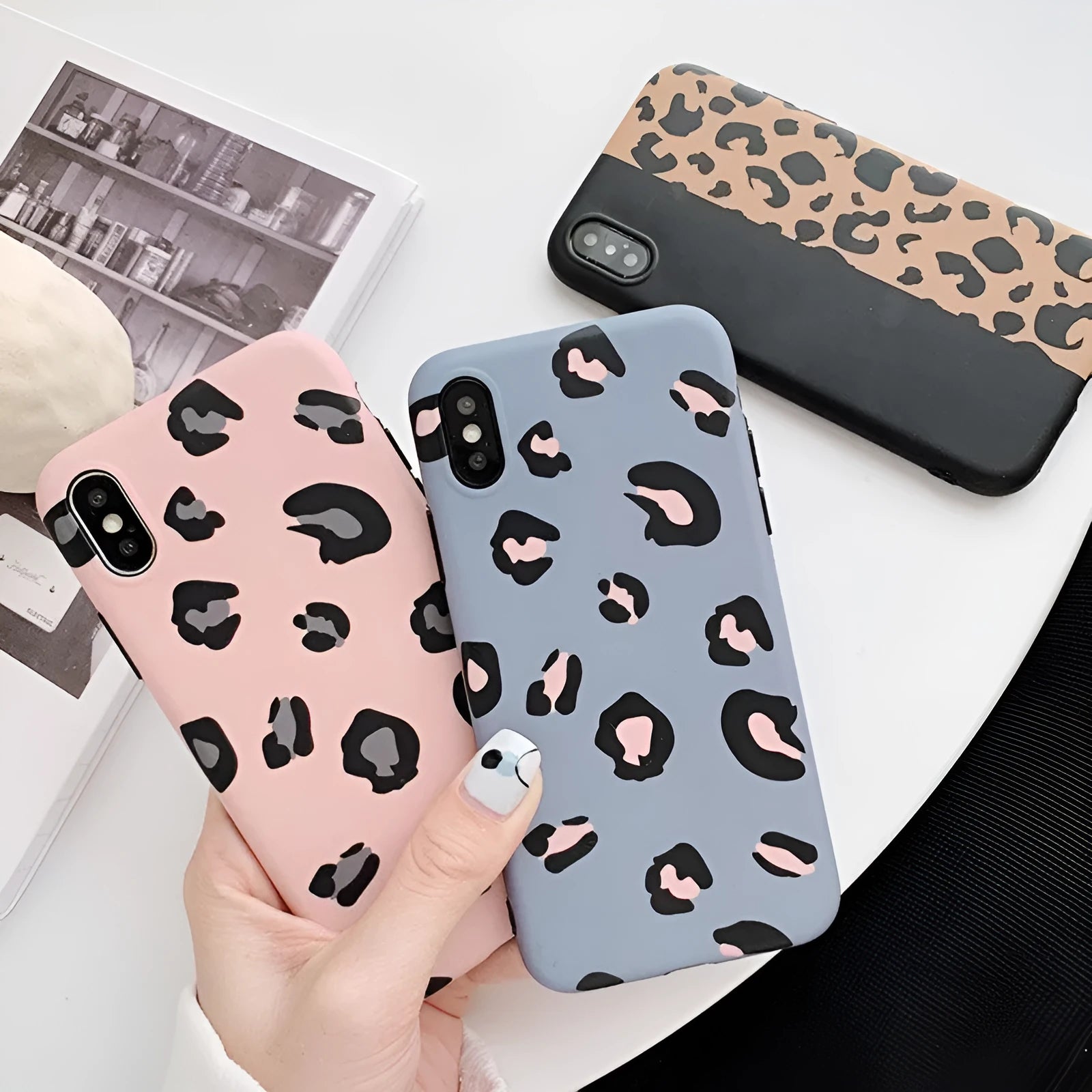 Leopard print pattern hard case for iPhone in black, blue, or pink.