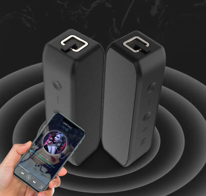 Black waterproof Bluetooth speaker with control buttons and USB interface