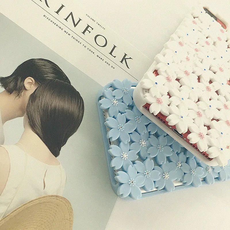 Blue silicone phone case with three-dimensional hollow flower openwork design for iPhone models