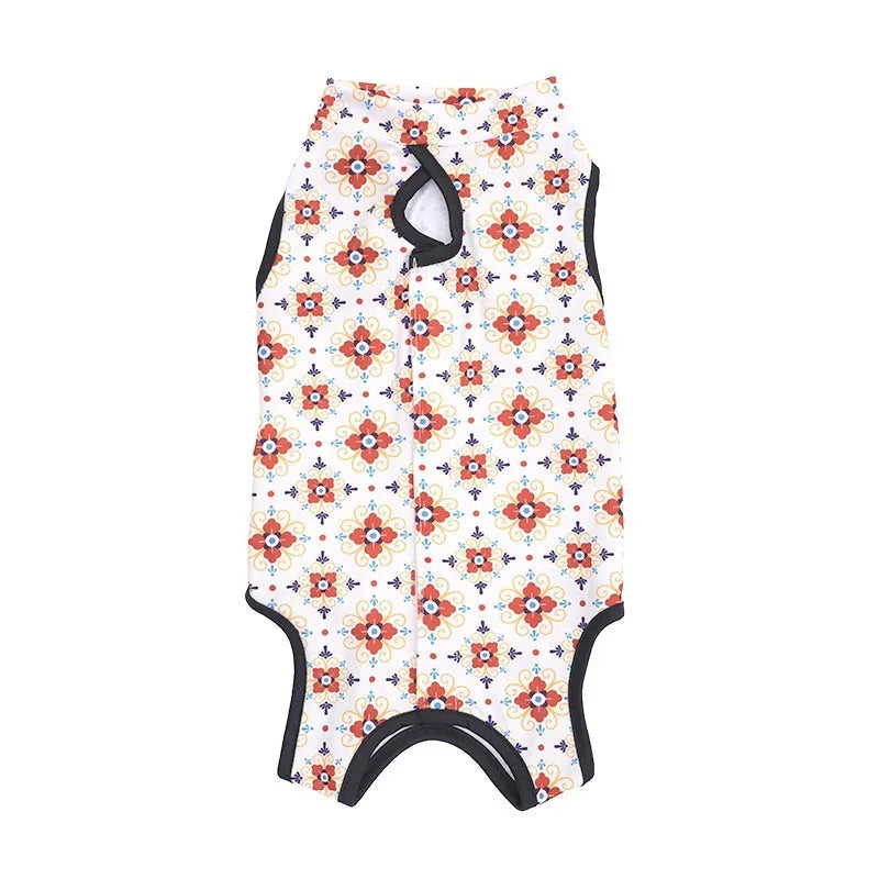 Cat wearing sterilisation recovery suit with Velcro closure in colourful print design