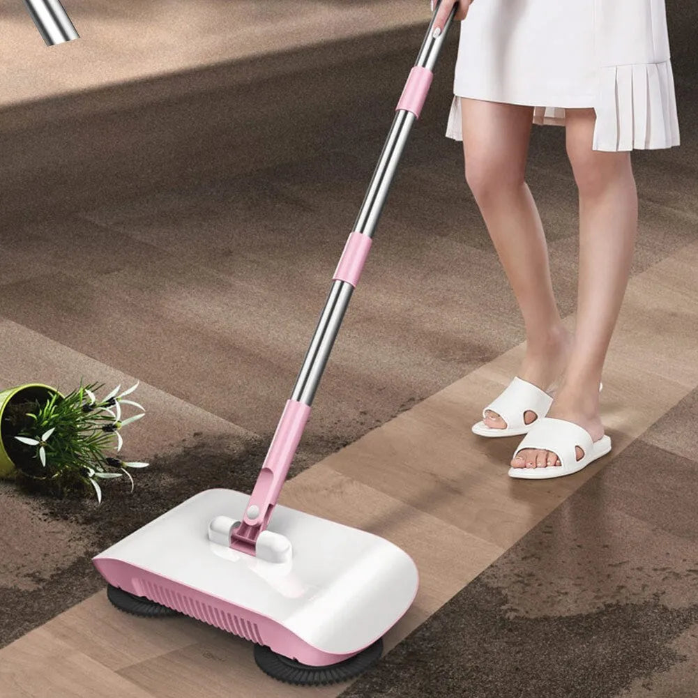 Pink hand push sweeper with rotating brush and mop attachment on tiled floor
