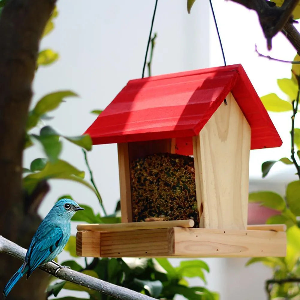Suspended pine wood bird feeder with red roof and log texture finish