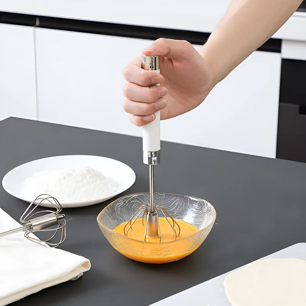Semi-automatic stainless steel egg beater whisk with hand pressure rotating mechanism in silvery colour