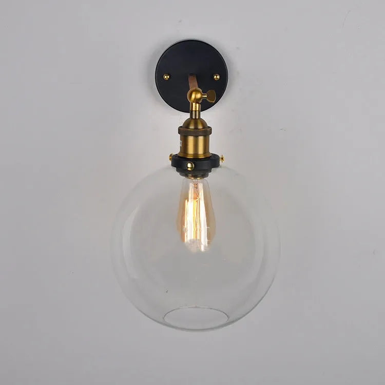 Round glass wall lamp with aluminium holder in transparent, amber, or smoky grey colour options
