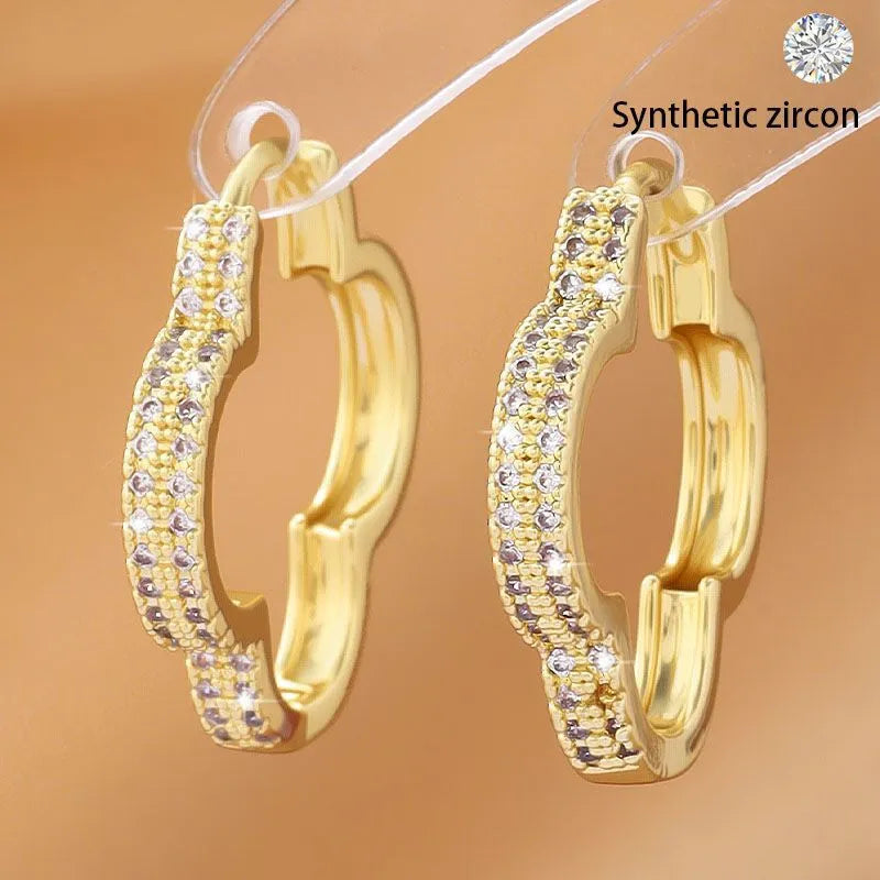Gold copper heart-shaped earrings with micro-inlaid zirconia stones geometric design