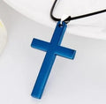 Stainless steel titanium alloy cross pendant on a black whip chain against a dark background