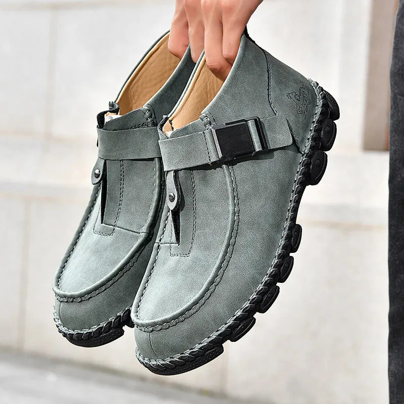 Casual flat heel slip-on shoe in synthetic leather with handmade stitching on the sole.