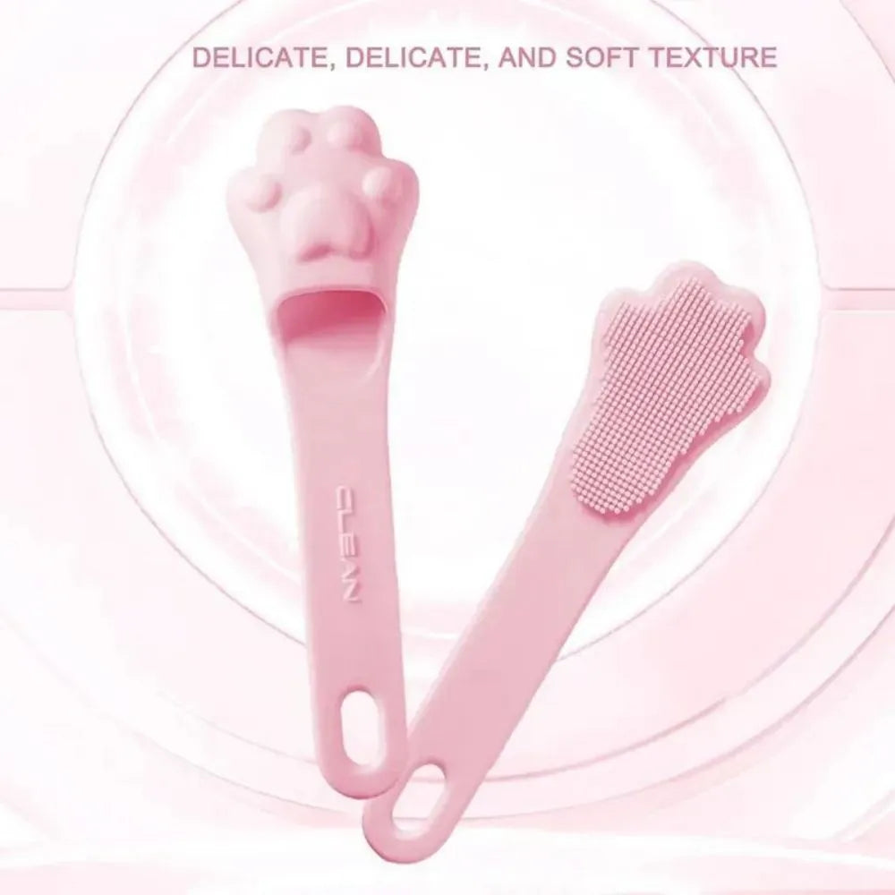 Silicone finger cover toothbrush for pet dental cleaning in pink, purple, and yellow colours.