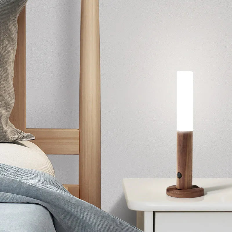 Smart motion sensor LED desk lamp made of solid wood and acrylic with a rechargeable battery.