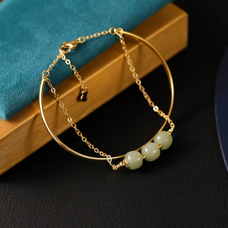 Women's Hetian jade lucky beads bracelet with gold inlay, shown in single, double, and three beads versions.