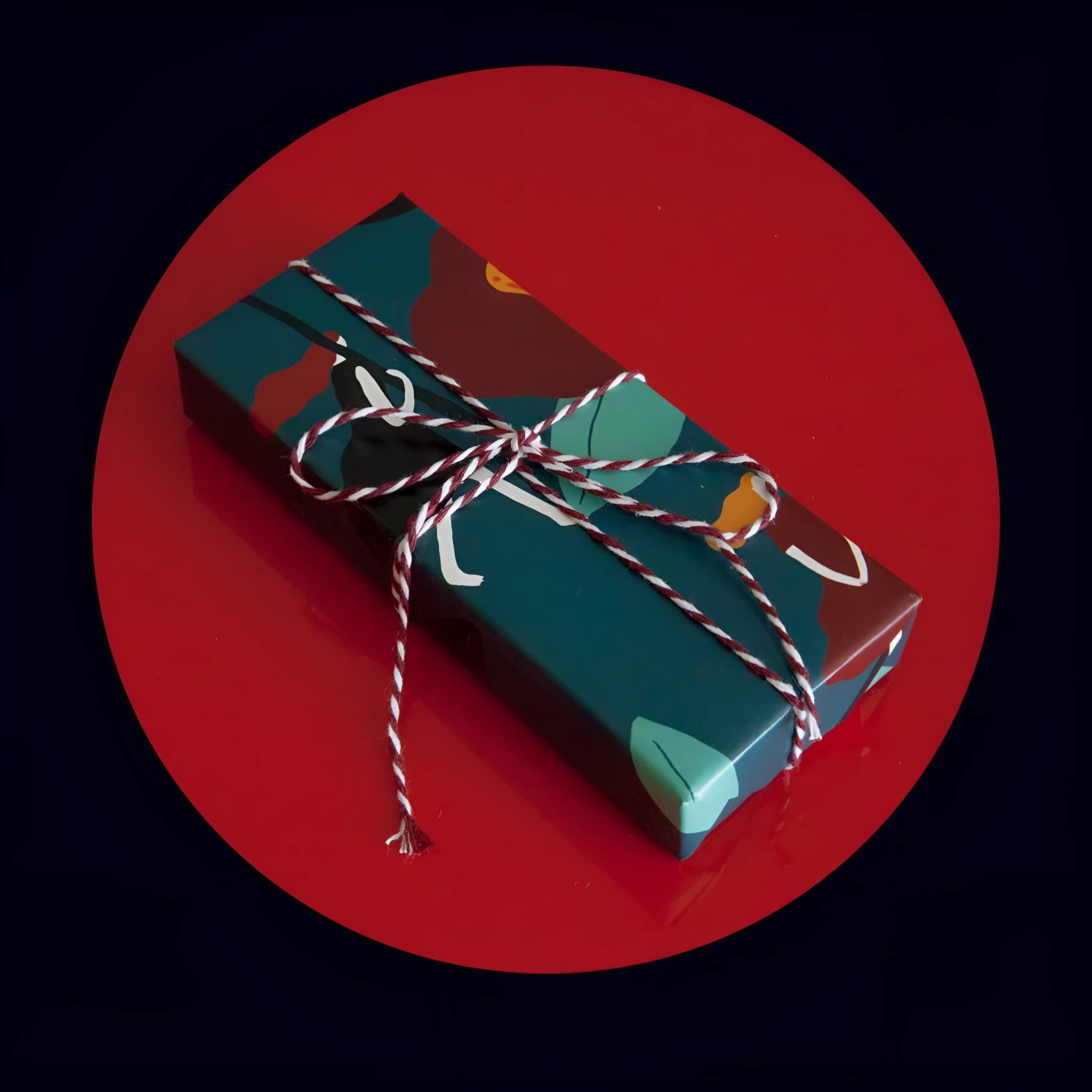 Green waterproof Christmas gift wrapping paper with Camellia design and black ribbon for gift boxes