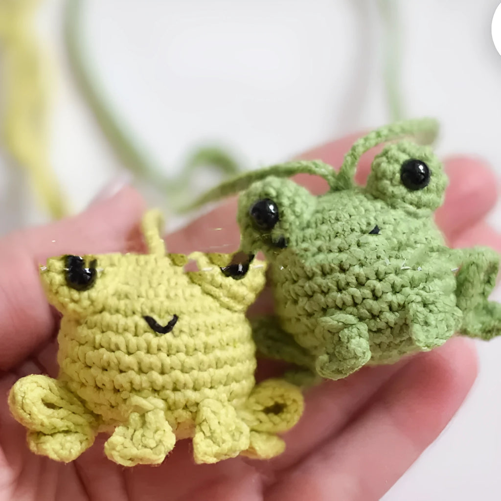 Handmade woven plush frog car pendant hanging in vehicle