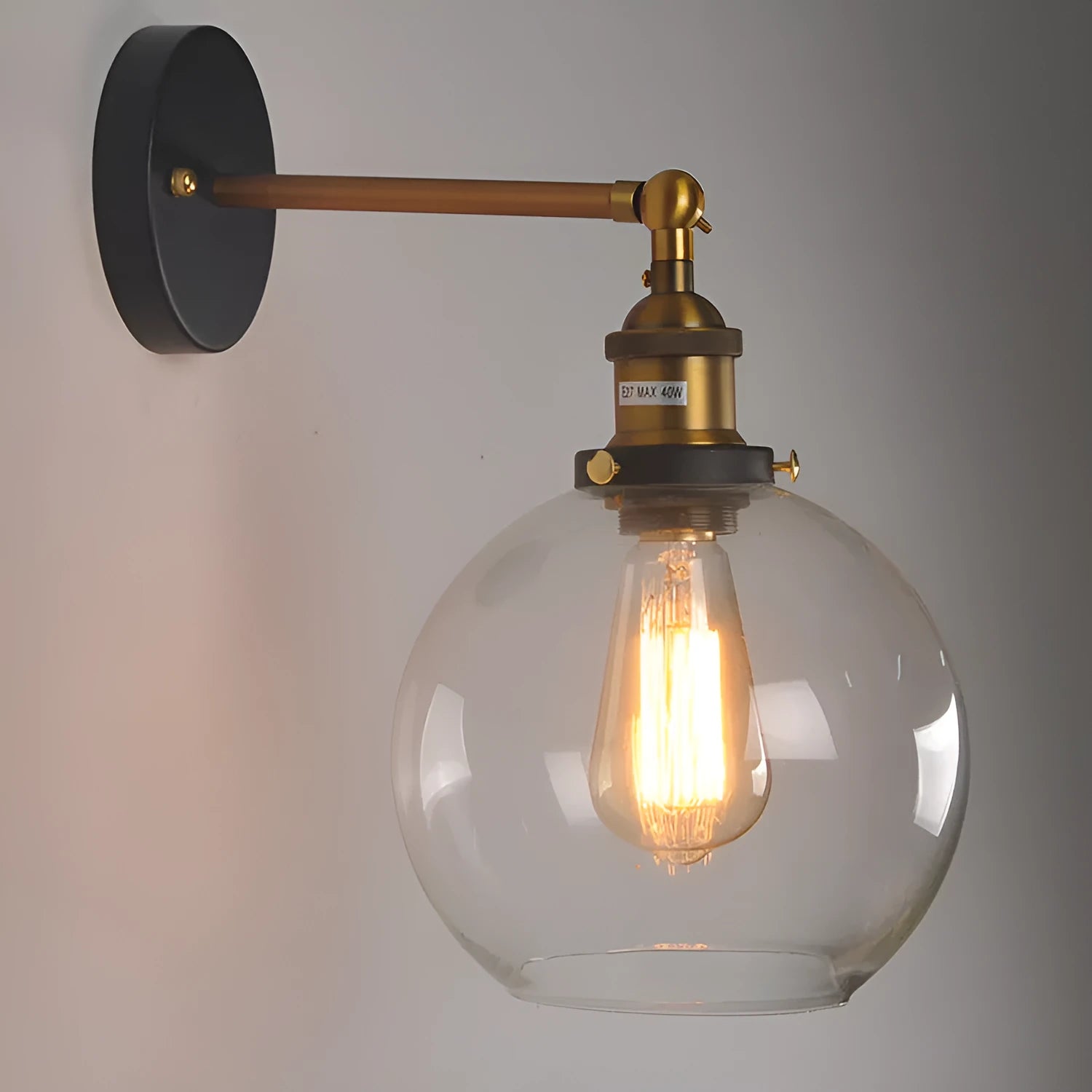 Round glass wall lamp with aluminium holder in transparent, amber, or smoky grey colour options