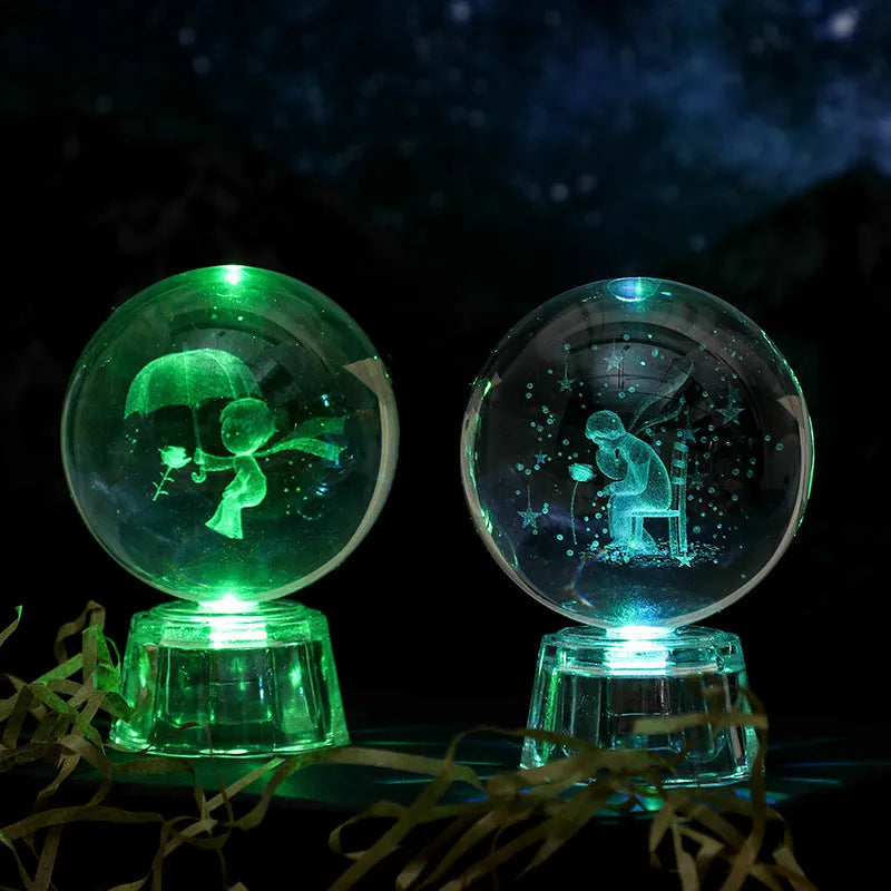 Transparent 6cm white crystal ball ornament with inner carving on a tabletop.