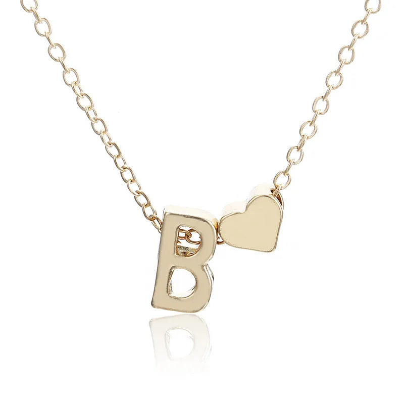 Peach heart shaped letter necklace pendant in gold or silver alloy measuring 20-24mm
