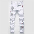White shredded embroidery jeans in cotton denim, sizes 29-38, with ripped and embroidered details.