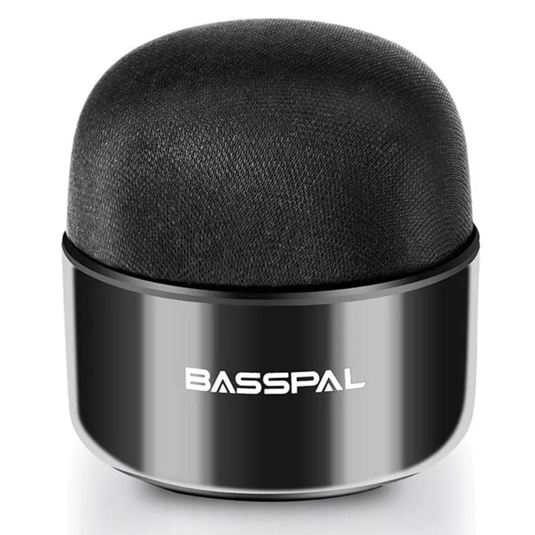 Black mini portable Bluetooth speaker with waterproof IPX7 rating on a textured surface.