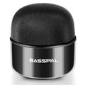 Black mini portable Bluetooth speaker with waterproof IPX7 rating on a textured surface.