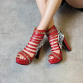 Fish mouth Roman style high-top shoes with a thick block heel and snake skin texture upper.