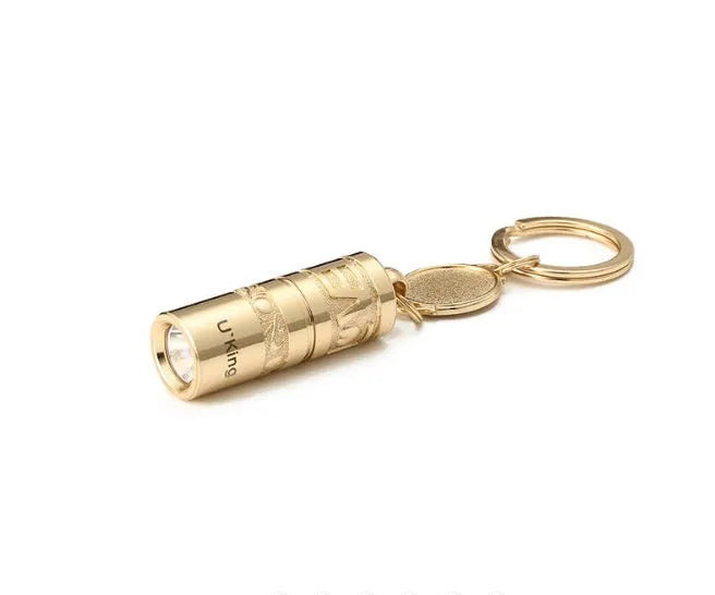 Gold waterproof LED flashlight keychain with zinc alloy die-cast housing and polished finish