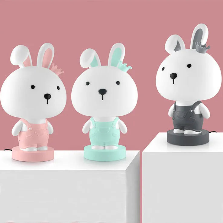 Cartoon animal table lamp in plastic, available as a bear, cow, rabbit, or tiger design.
