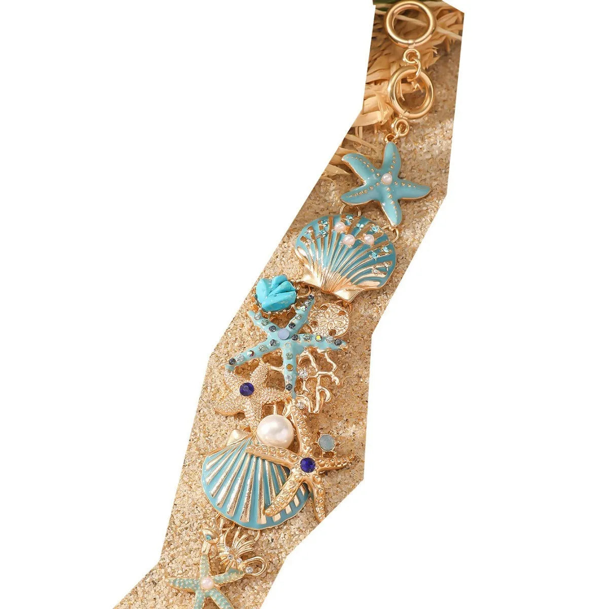 Alloy rhinestone bracelet with boat anchor and starfish charm in turquoise, red, or blue.