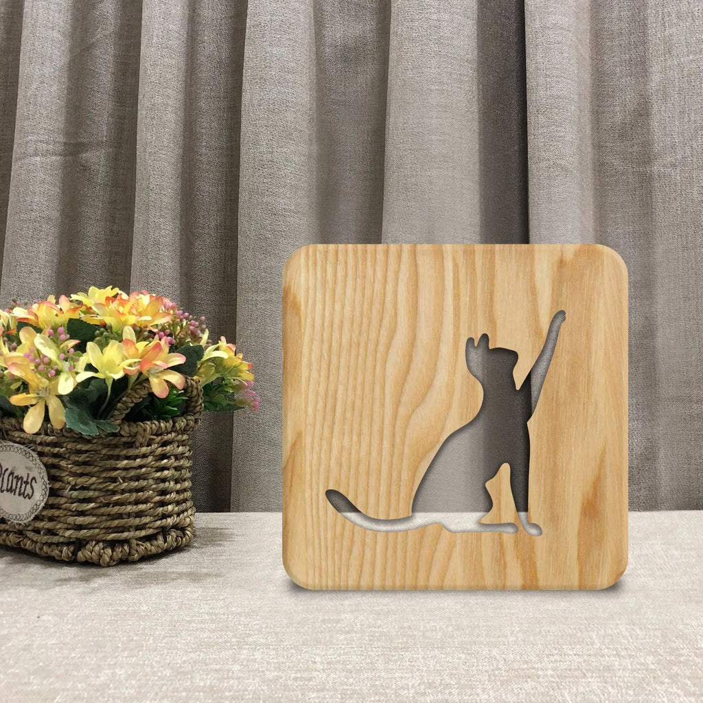 Solid wood cat night light with hollow 3D design measuring 190mm square