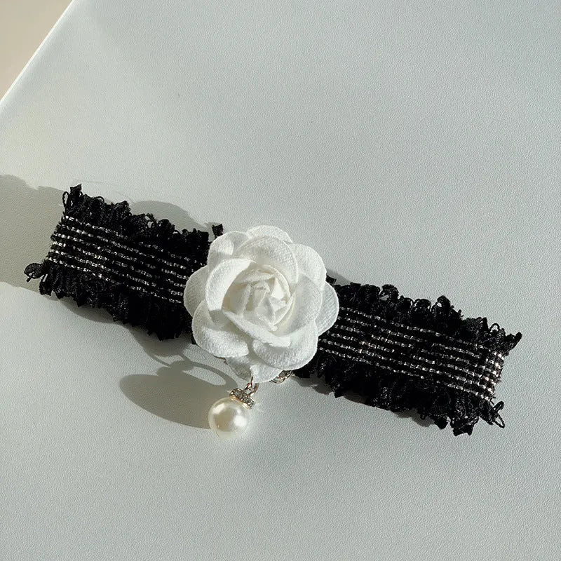 Magnolia flower pet collar accessory with chain in black on white background