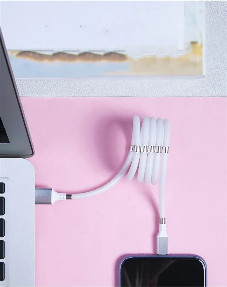 Black magnetic data cable showing Micro USB, USB Type-C and 3.5mm connector interfaces with ends snapped together