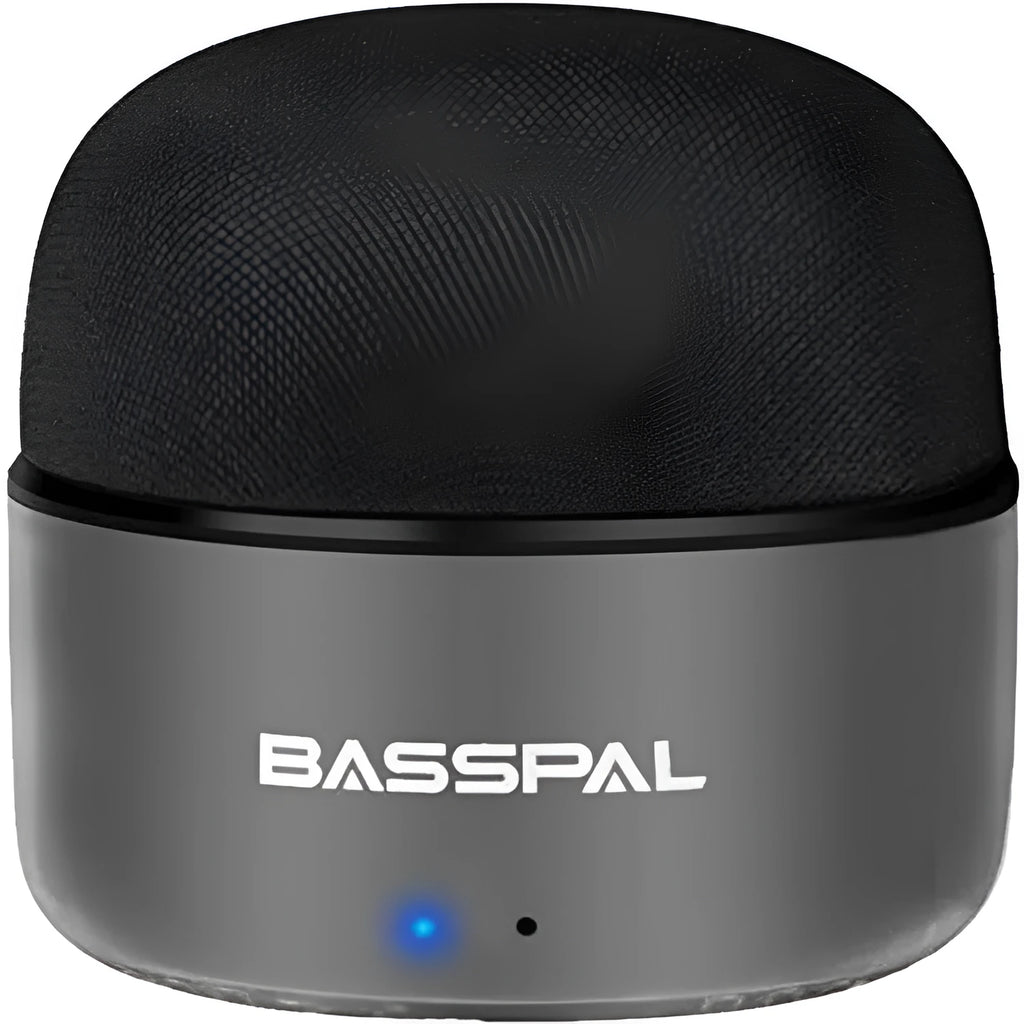 Black mini portable Bluetooth speaker with waterproof IPX7 rating on a textured surface.