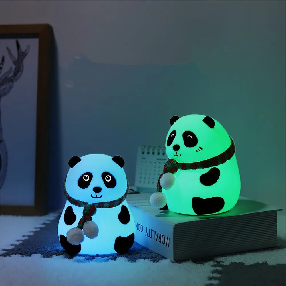 Panda-shaped silicone night light with USB cable on a table