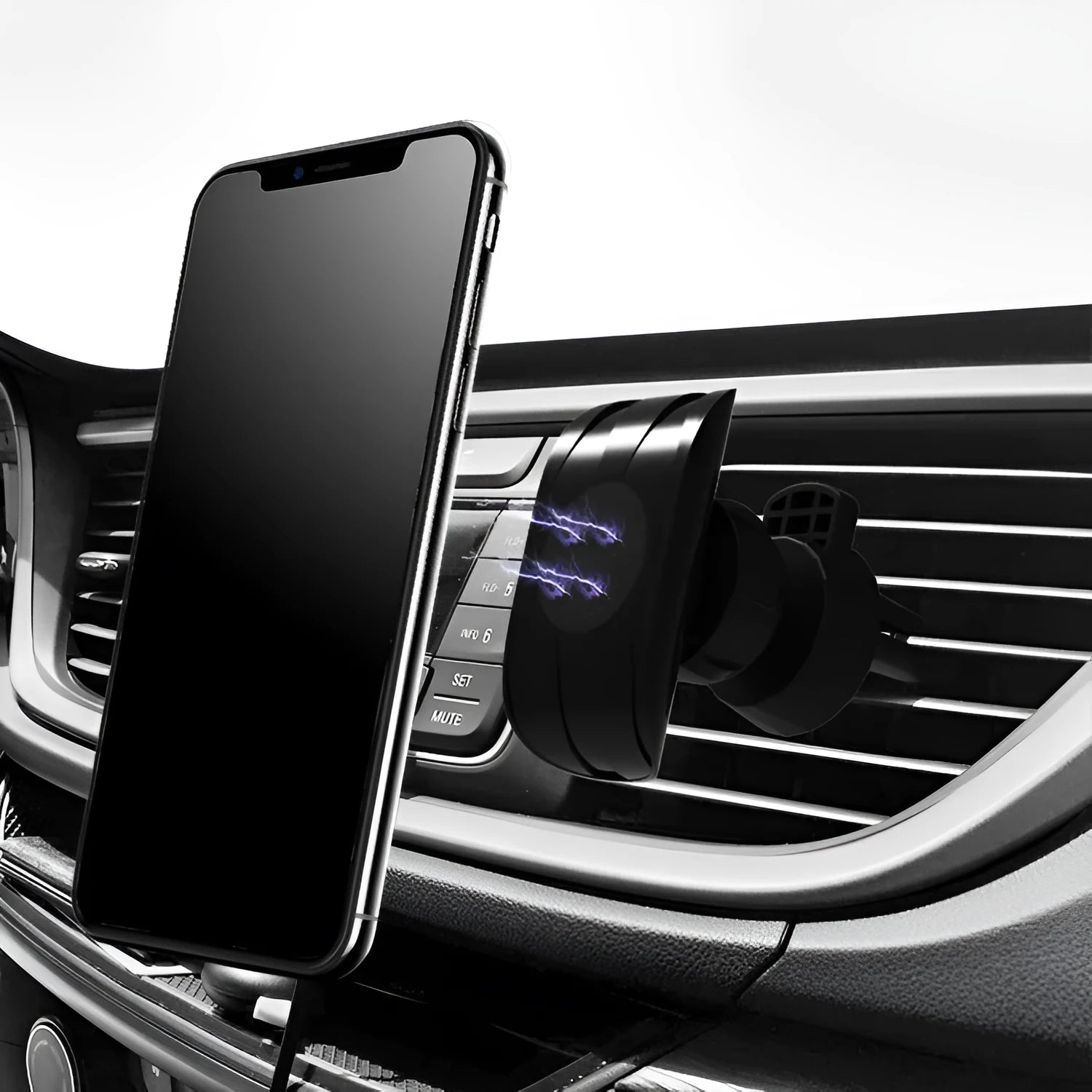 Black magnetic car phone holder mounted on car air vent with phone attached