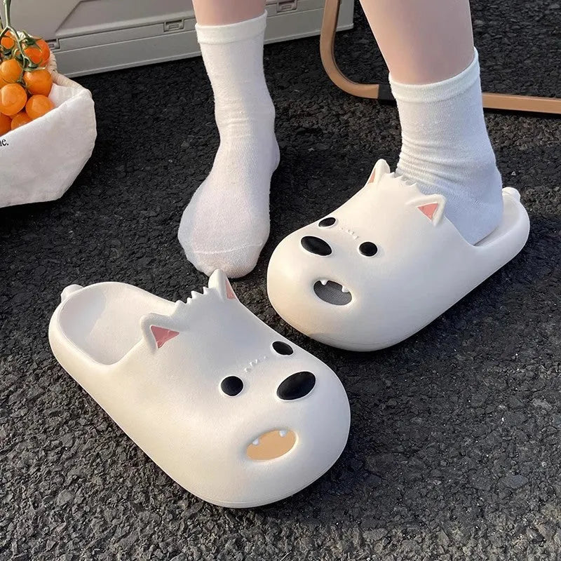 Women's black EVA foam puppy slippers with a toe cap sandal design on a white background.