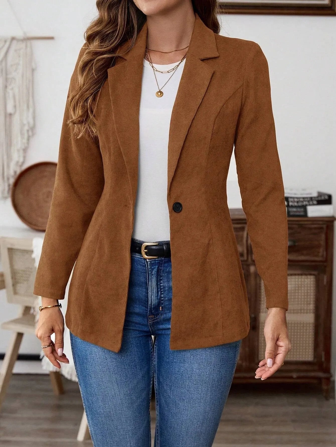 Brown single-breasted lapel coat for men with long sleeves, shown on a hanger.