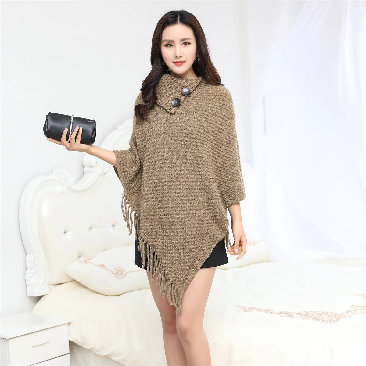 Women's sleeveless knitted cloak shawl with dot pattern in apricot colour