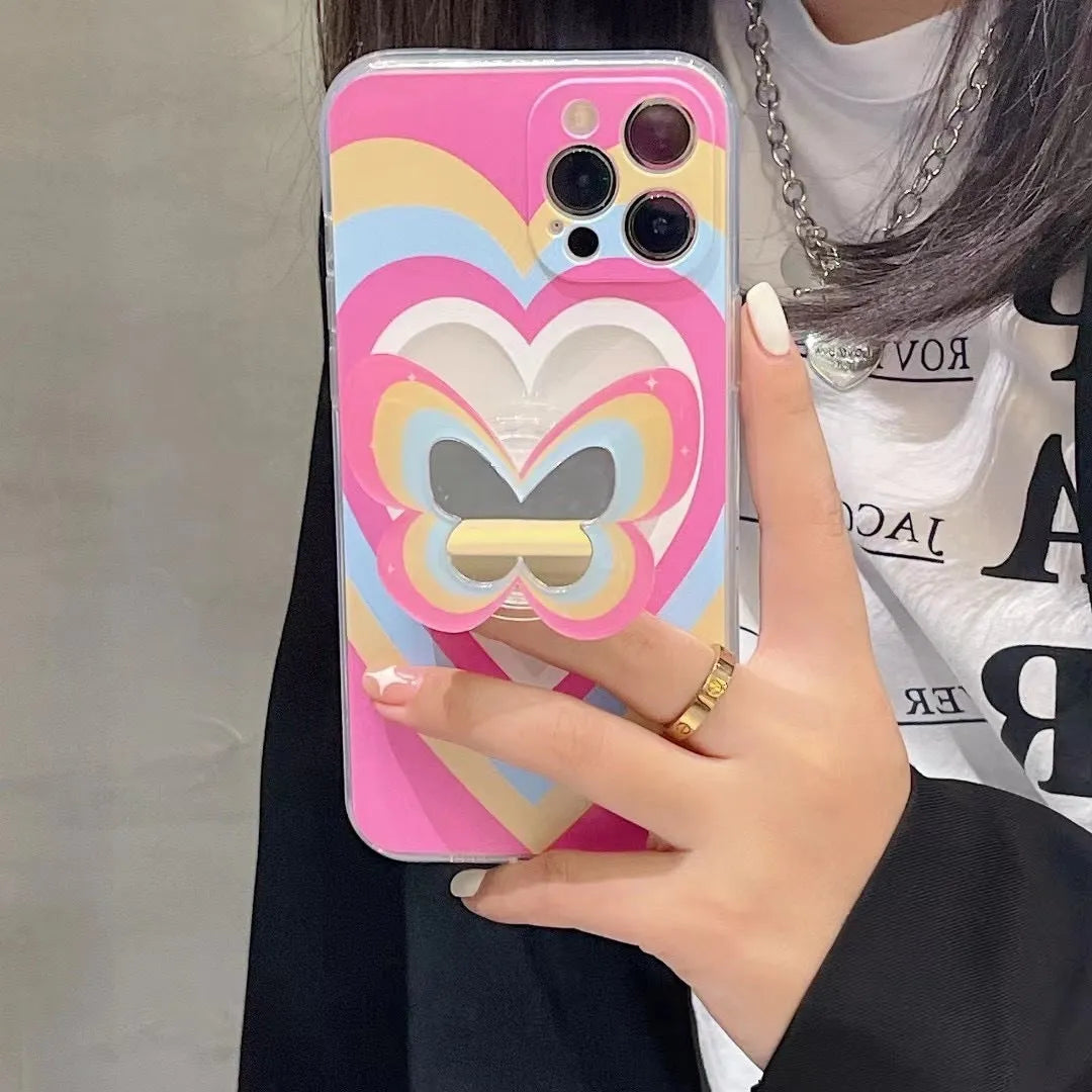 Color butterfly stand silicone phone case for iPhone in blue with TPU back cover and folded-out stand on a table
