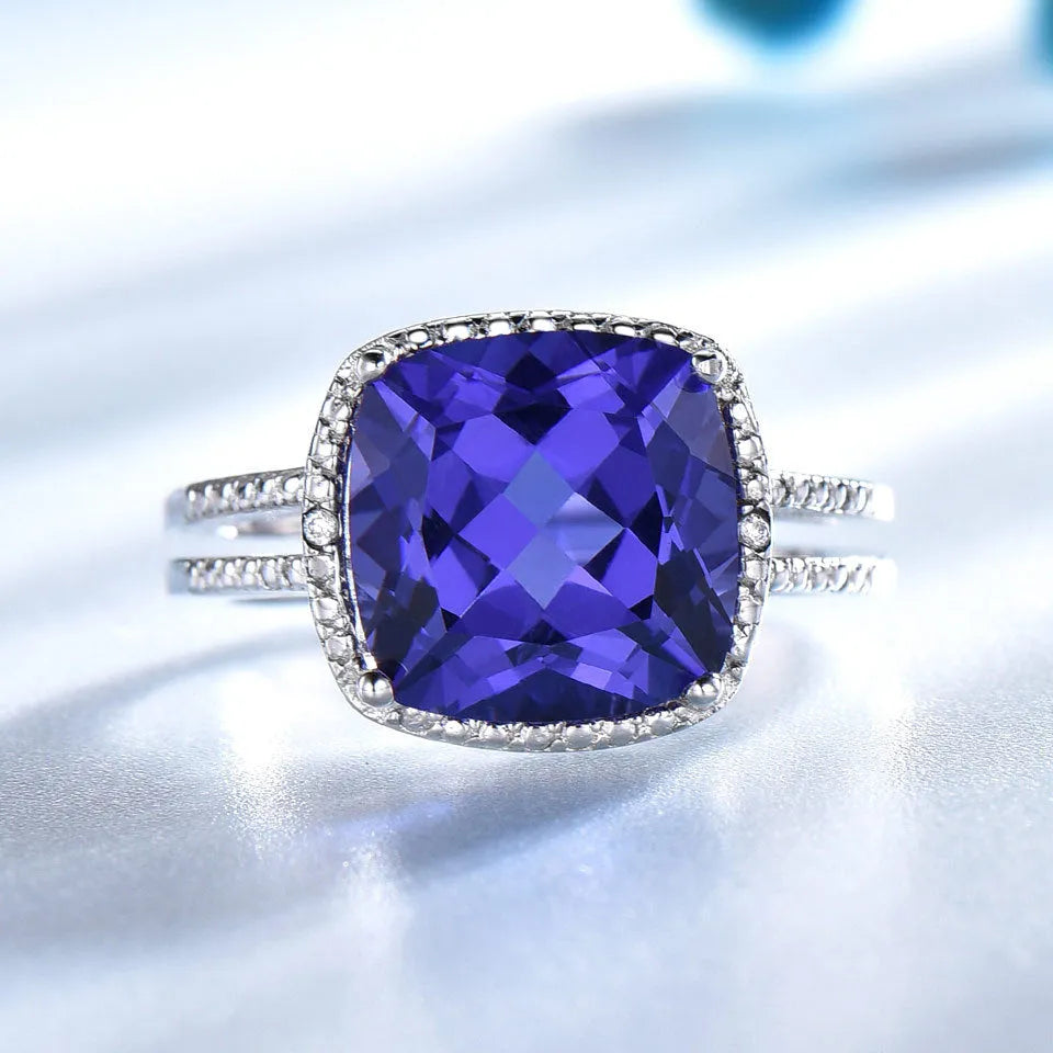 Women's sterling silver 925 ring with a blue tanzanite gemstone centrepiece.
