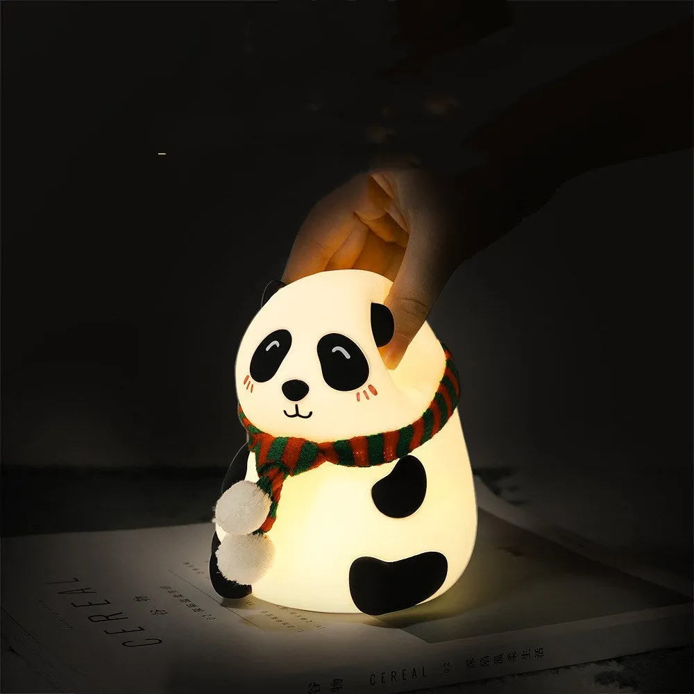 Panda-shaped silicone night light with USB cable on a table