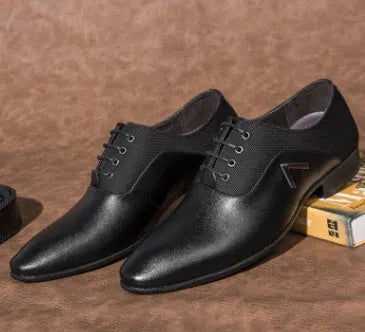 Men's black oxford shoes with low upper height and rubber sole on size chart background
