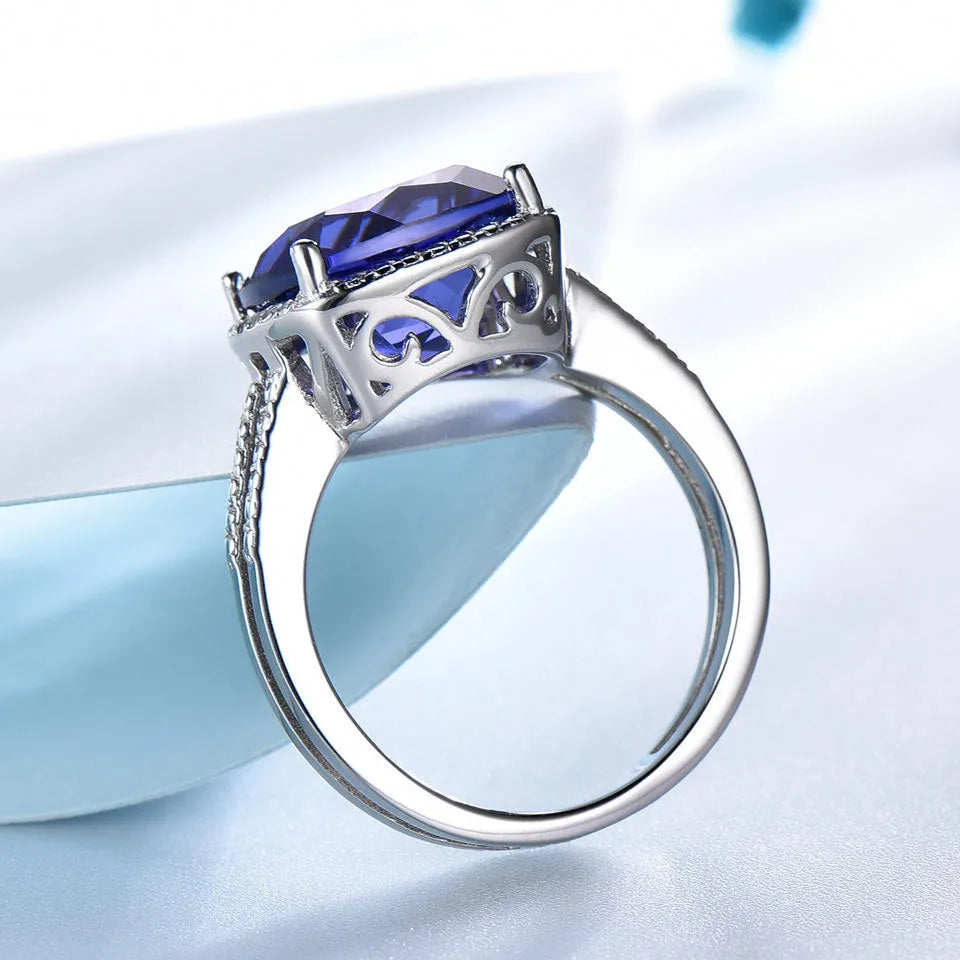 Women's sterling silver 925 ring with a blue tanzanite gemstone centrepiece.