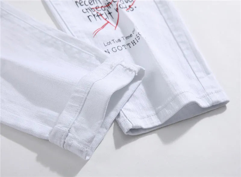 White shredded embroidery jeans in cotton denim, sizes 29-38, with ripped and embroidered details.
