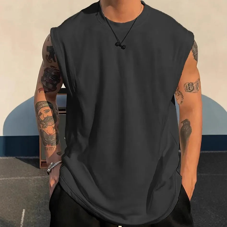 Men's loose solid colour cotton pullover tank top on a hanger, showing sleeveless design.