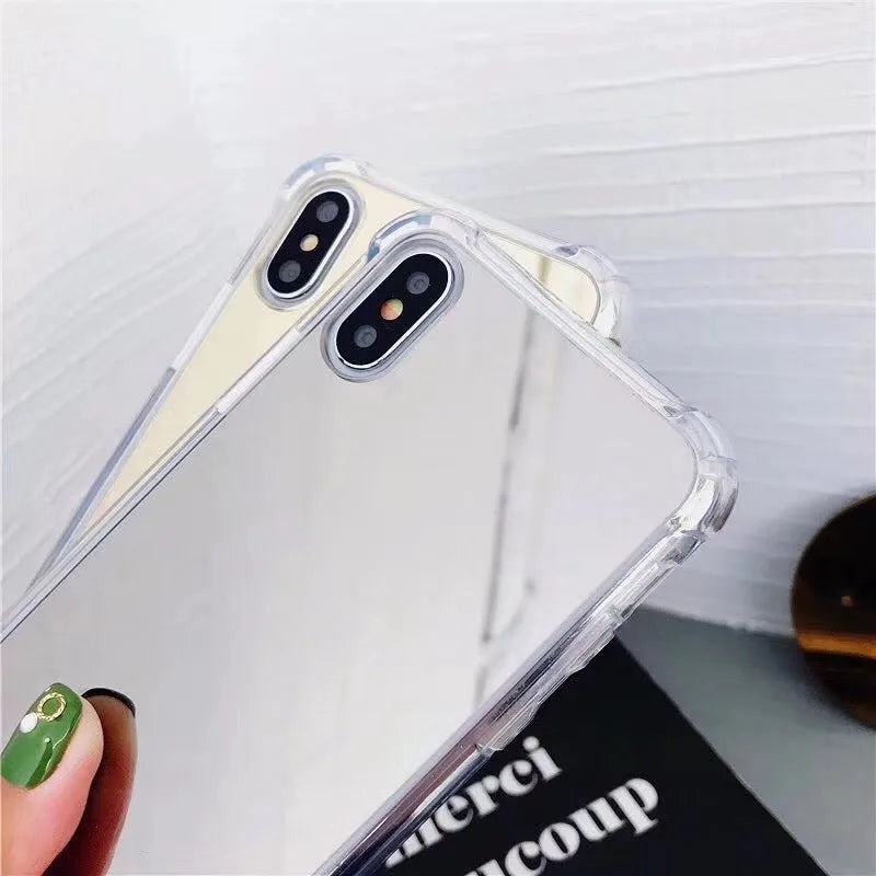 Mirror finish iPhone case with reflective surface showing TPU flexible construction and precise port cutouts