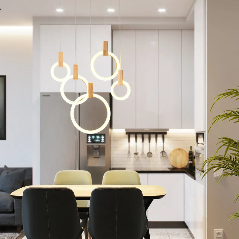 White wooden LED chandelier with three ring sizes 200 300 and 400mm on fishing line suspension for living room