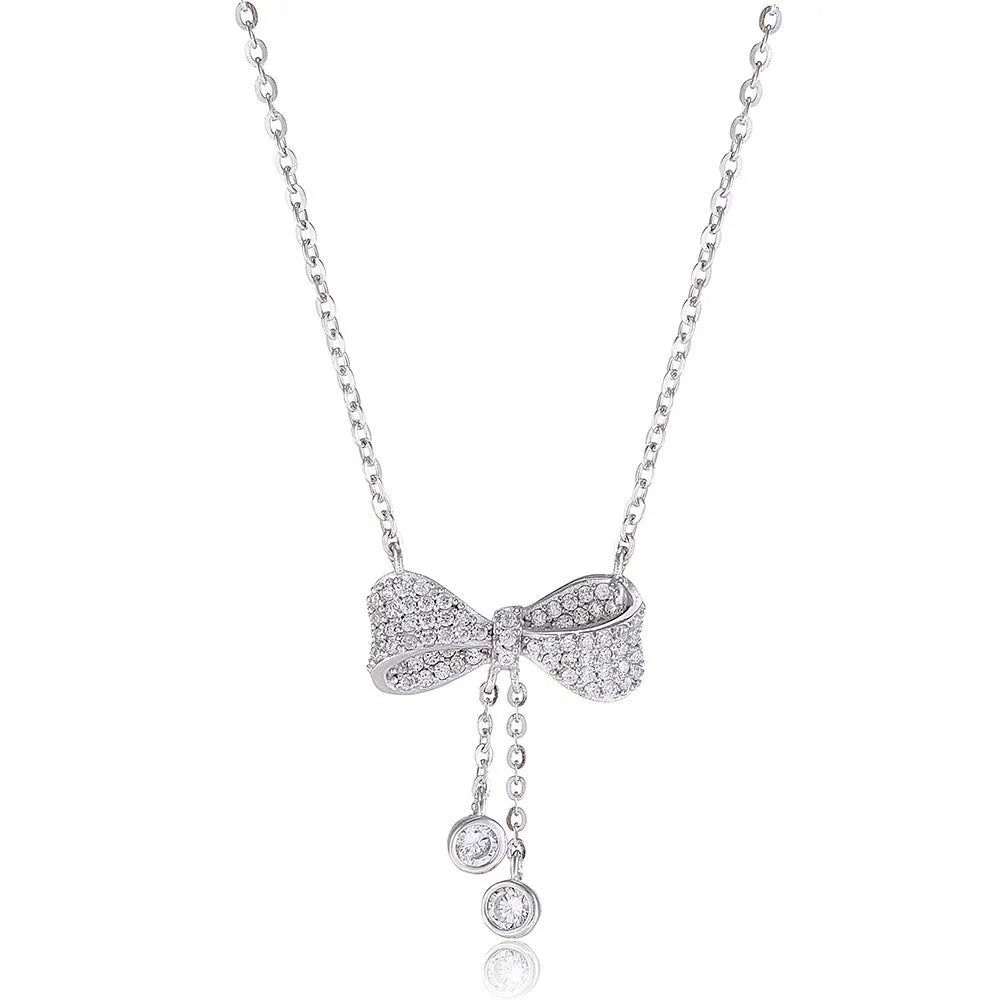S925 sterling silver necklace with bow pendant on an O-ring chain, shown at clavicle length.