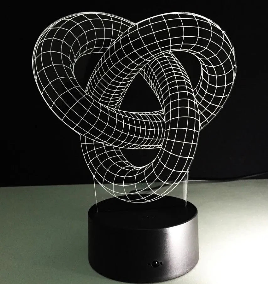 Knot 2 3D optical illusion LED lamp hologram with remote control and touch operation on a table