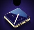 Compact blue cylindrical 20000mAh power bank with multiple USB ports on a white background.