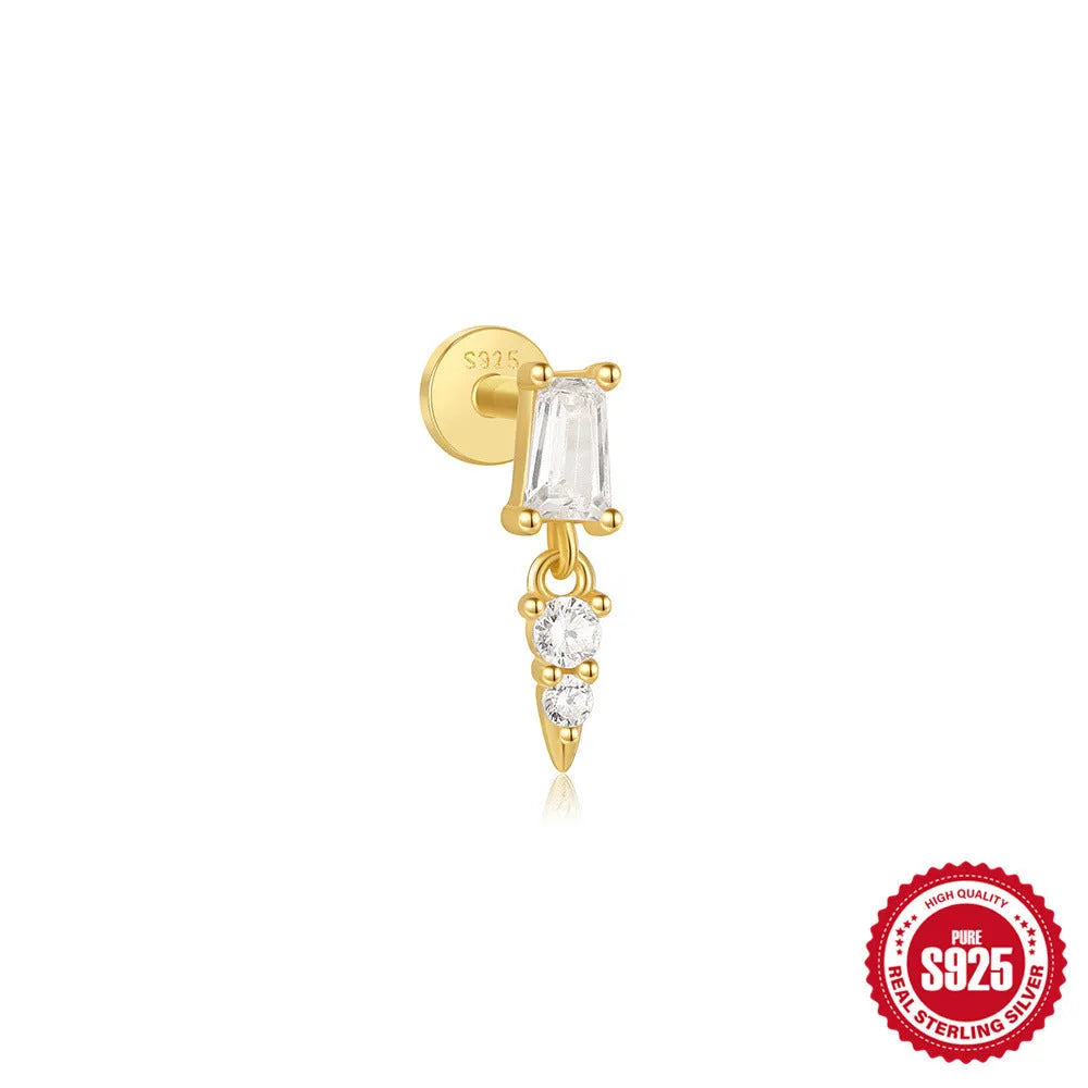 A gold tone sterling silver ear stud featuring a dangling tassel and XINGX inlaid design on the stud.