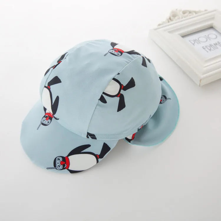Boys' penguin print long sleeve swimsuit with matching swimming cap for sun protection